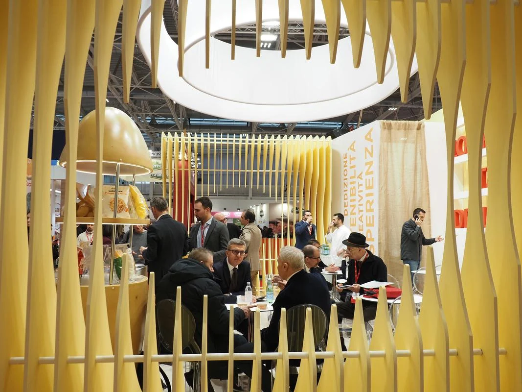 Business meetings take place inside a sculptural premium exhibition stand at MARCA 2026.