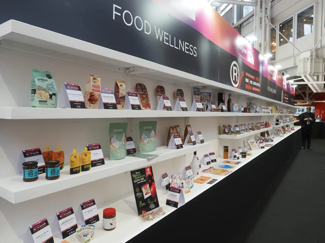 Rows of packaged private-label products and information cards form an innovation display at MARCA 2026.